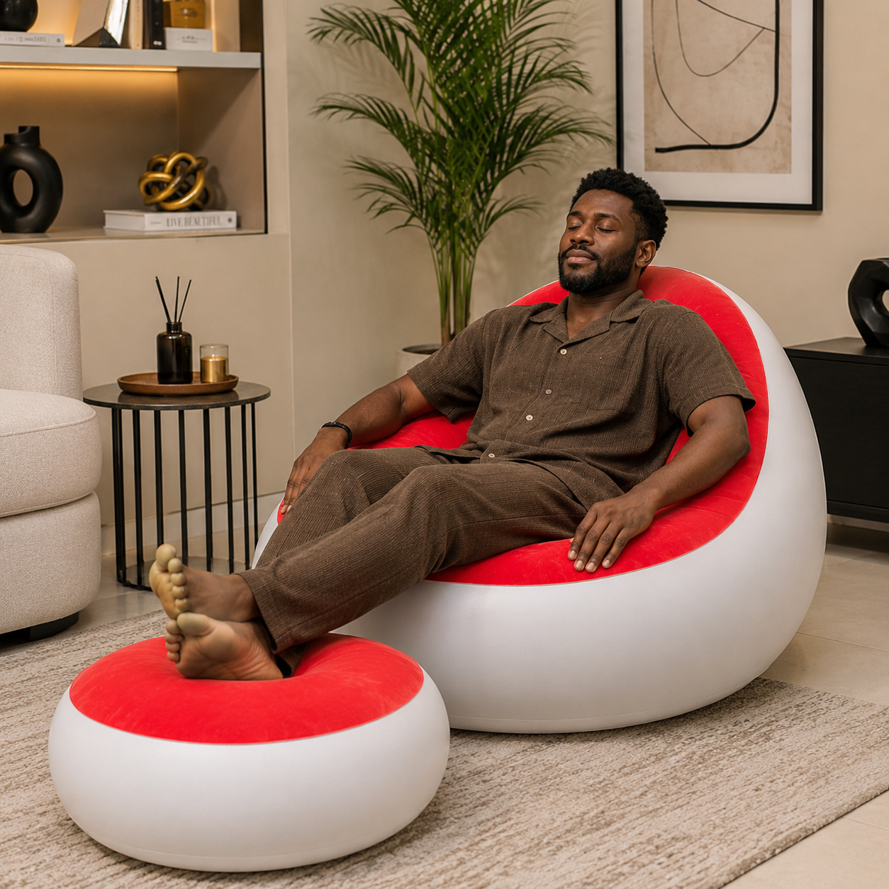 Man relaxing in red air sofa